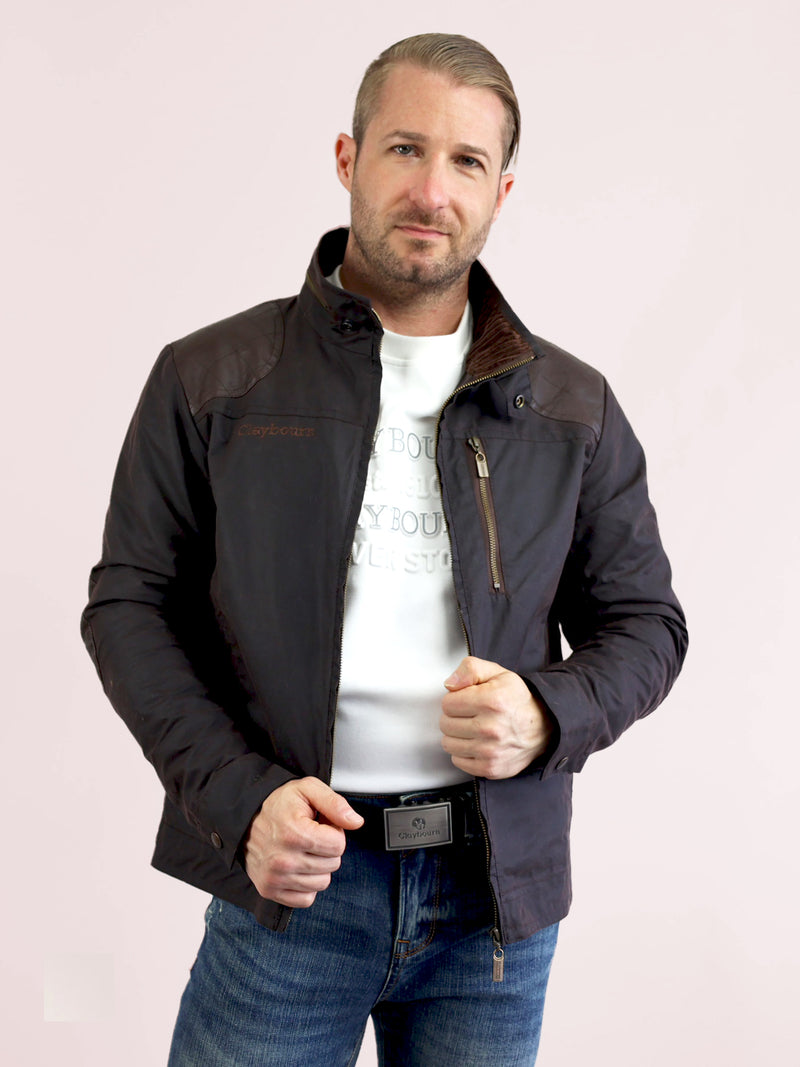 a guy wearing a black jacket with white inner shirt