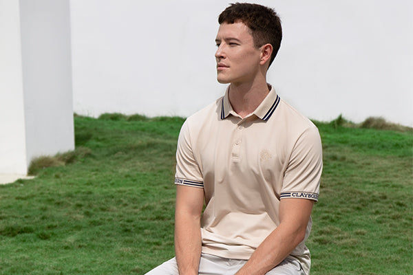 A man wearing a Claybourn polo shirt.